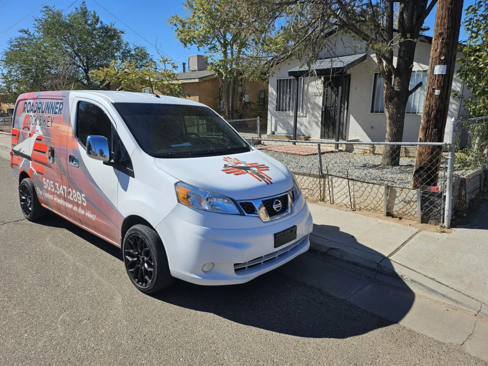 Roadrunner Lock and Key service van parked on a residential street