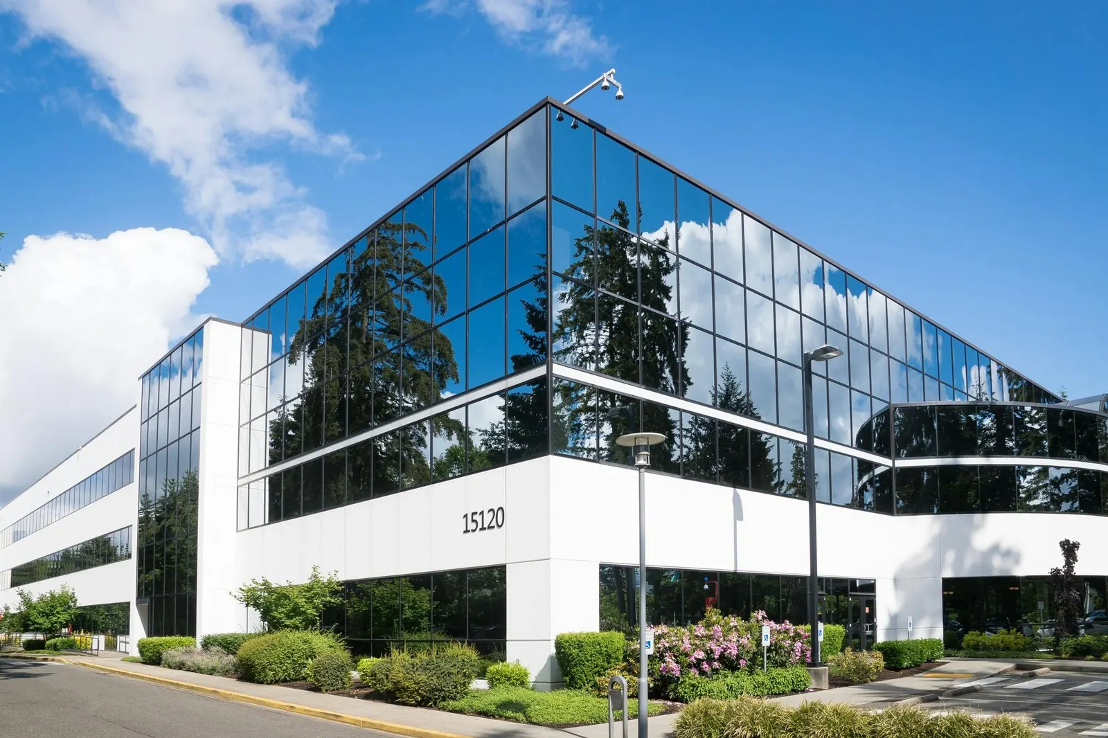 Modern glass office building on a sunny day